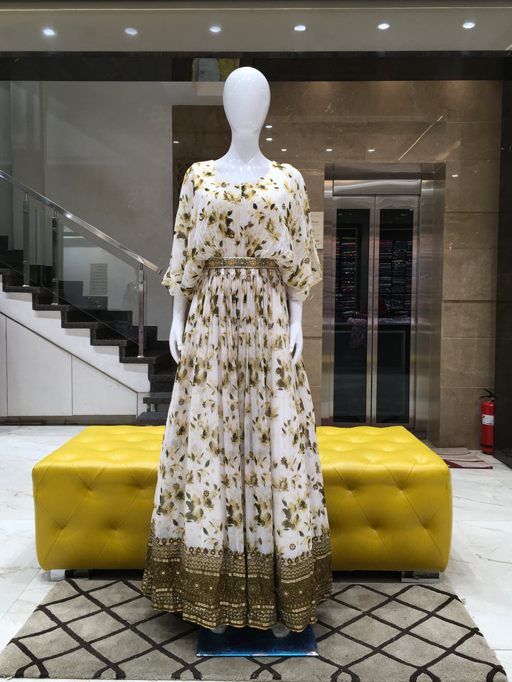 Brown Georgette floral printed gown with broad sequin border and winged sleeves for festive occasions