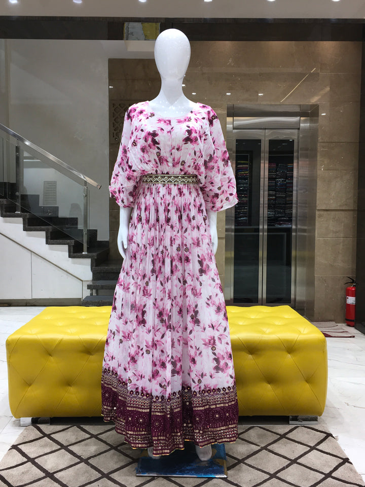 Purple Georgette floral printed gown with broad sequin border and winged sleeves for festive occasions