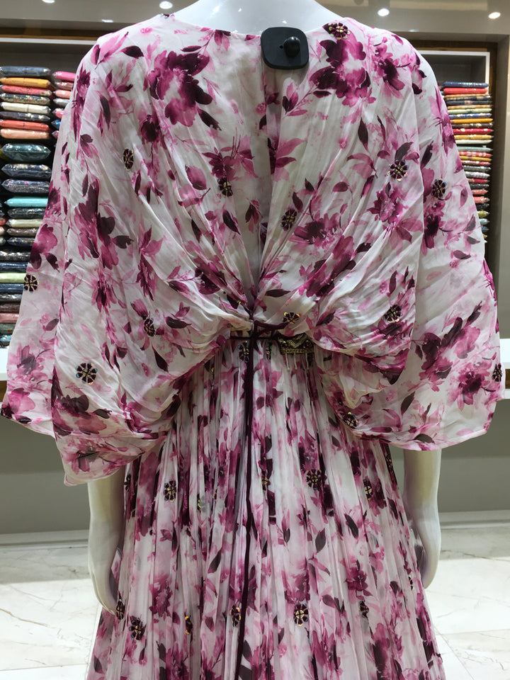 Purple partywear gown with winged sleeves, floral print, and sequin detailing