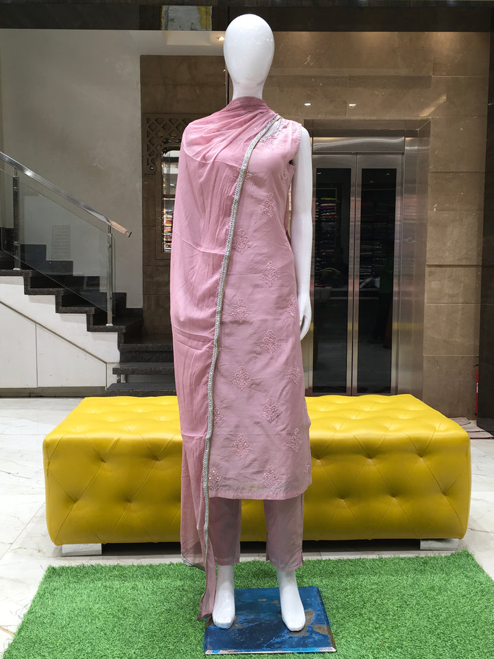 Chanderi Cotton Straight Cut Salwar Kameez with embroidered patch neckline, microstone detailing, pencil pants, and lace-trimmed chiffon dupatta.