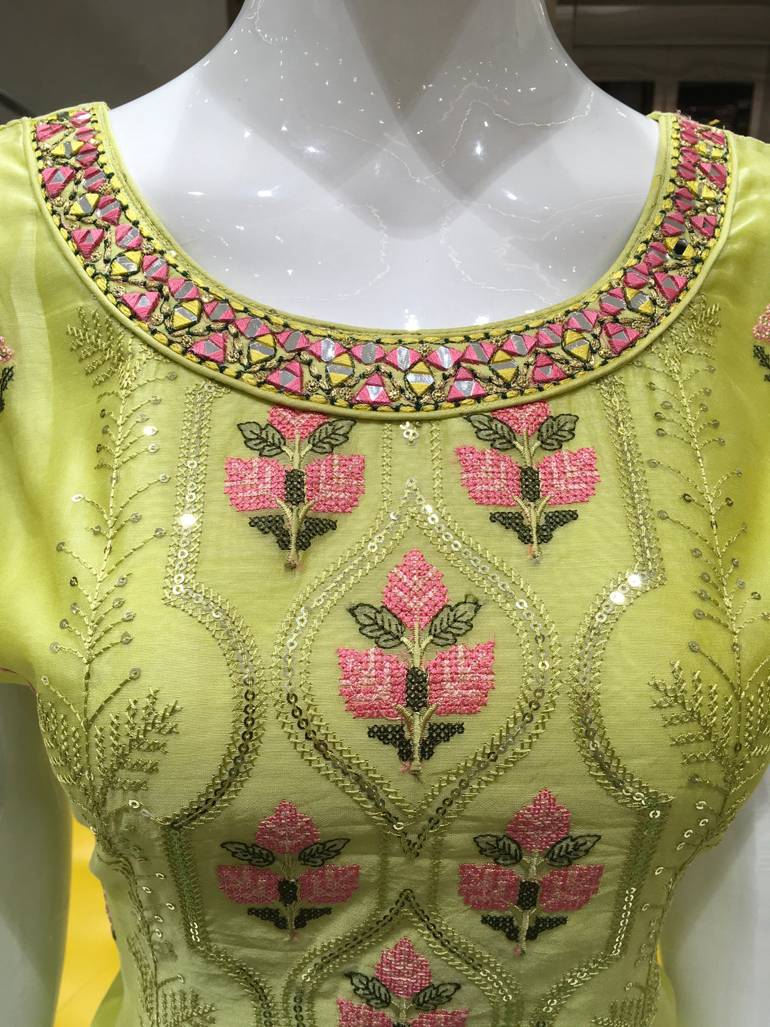Lime green kurta set with threadwork, shimmer finish, and festive styling