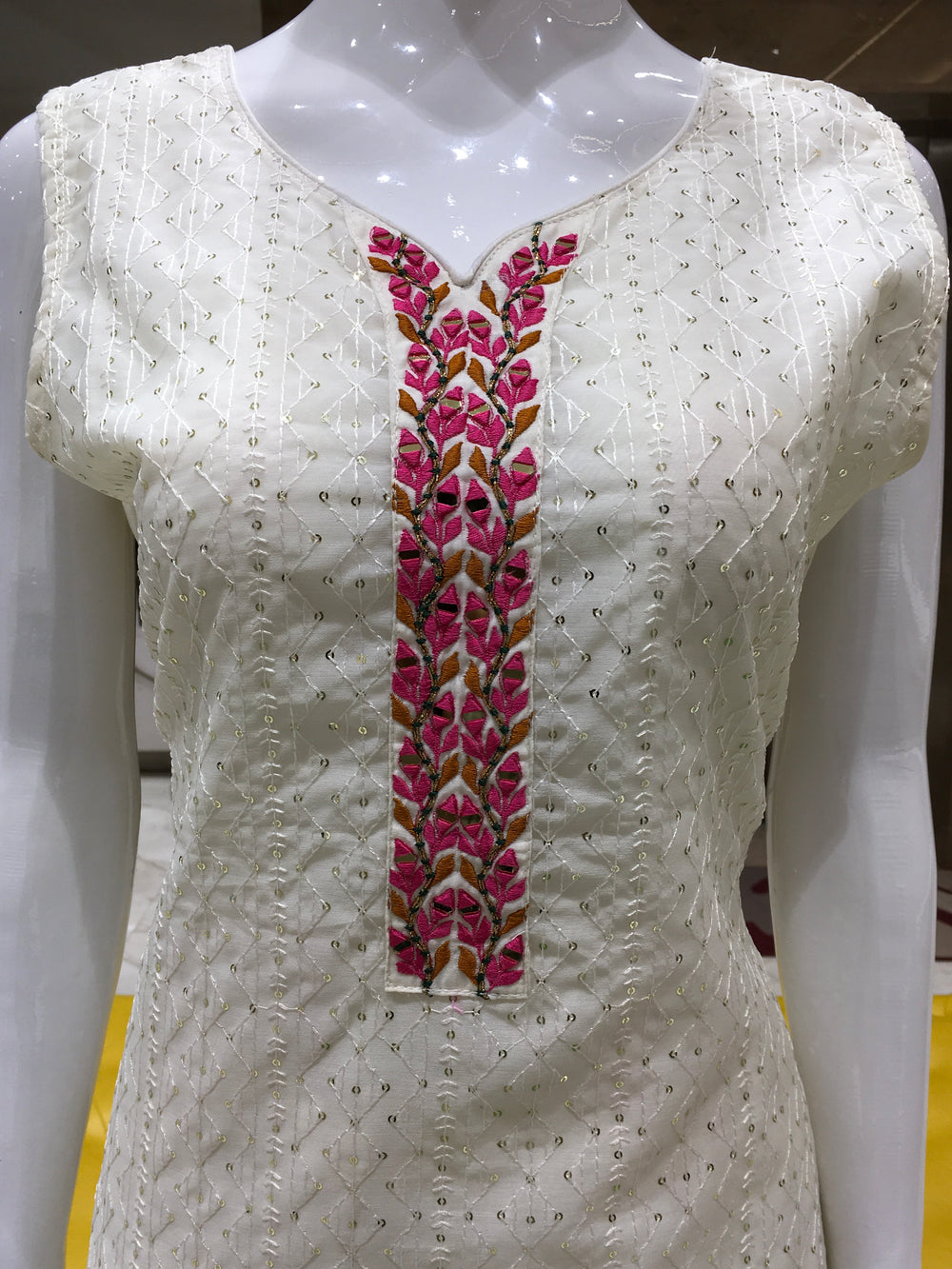 Cream Chanderi Cotton Straight Cut Salwar Kameez with sequin stripes, mirror accents, pencil pant, and floral printed chiffon dupatta.