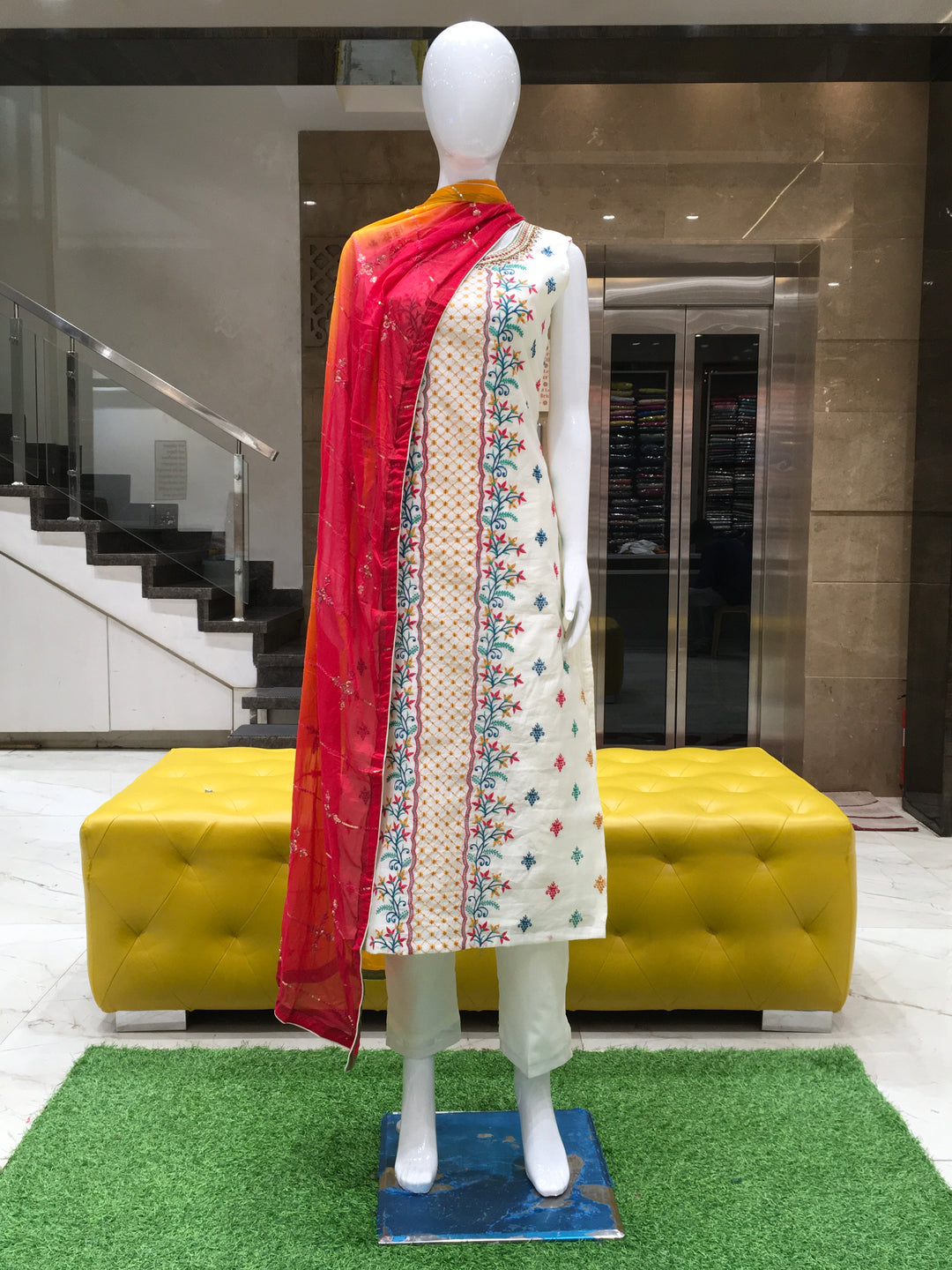 Chanderi Cotton Straight Cut Salwar Kameez with multicolor floral thread embroidery, pencil pants, and a dual-tone chiffon dupatta with sequin detailing.