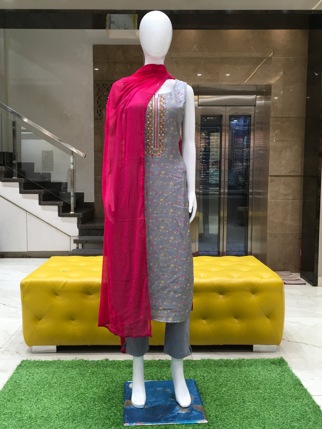Chanderi Cotton Straight Cut Salwar Kameez with polka dot print, thread embroidery on yoke, pencil pant, and contrast rani pink chiffon dupatta.

