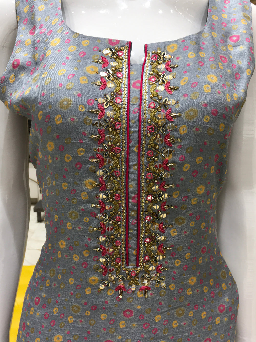 Chanderi Cotton Straight Cut Salwar Kameez with polka dot print, thread embroidery on yoke, pencil pant, and contrast rani pink chiffon dupatta.