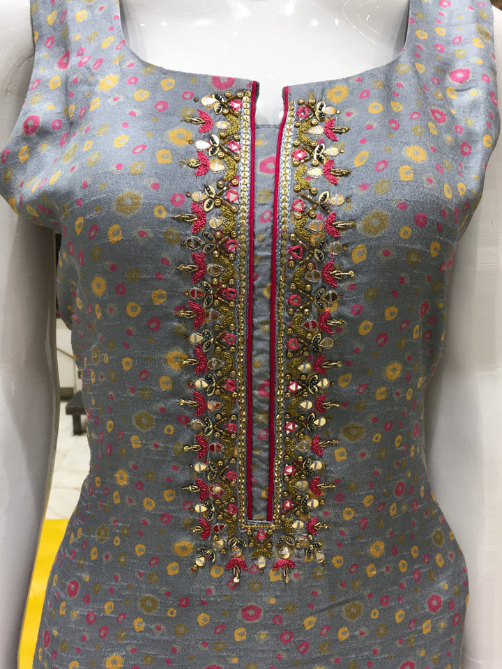 Chanderi Cotton Straight Cut Salwar Kameez with polka dot print, thread embroidery on yoke, pencil pant, and contrast rani pink chiffon dupatta.