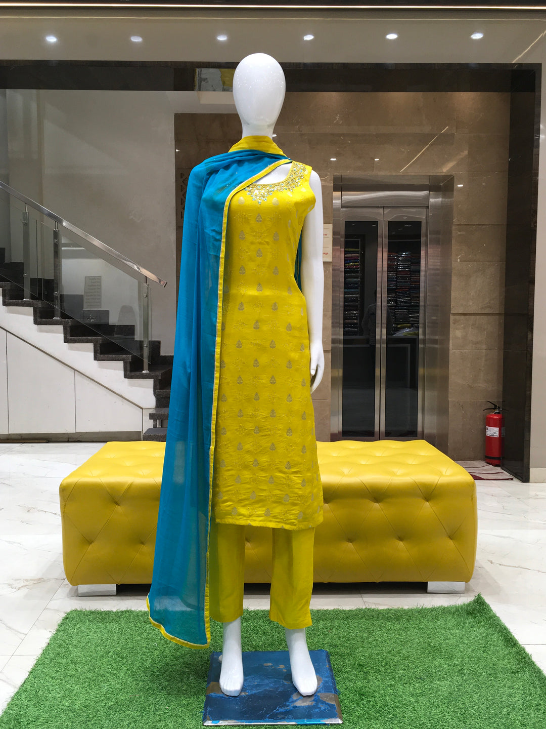 Chanderi Cotton Straight Cut Salwar Kameez in lemon green with embellished neckline, Banarasi motifs, and contrast blue shaded chiffon dupatta.