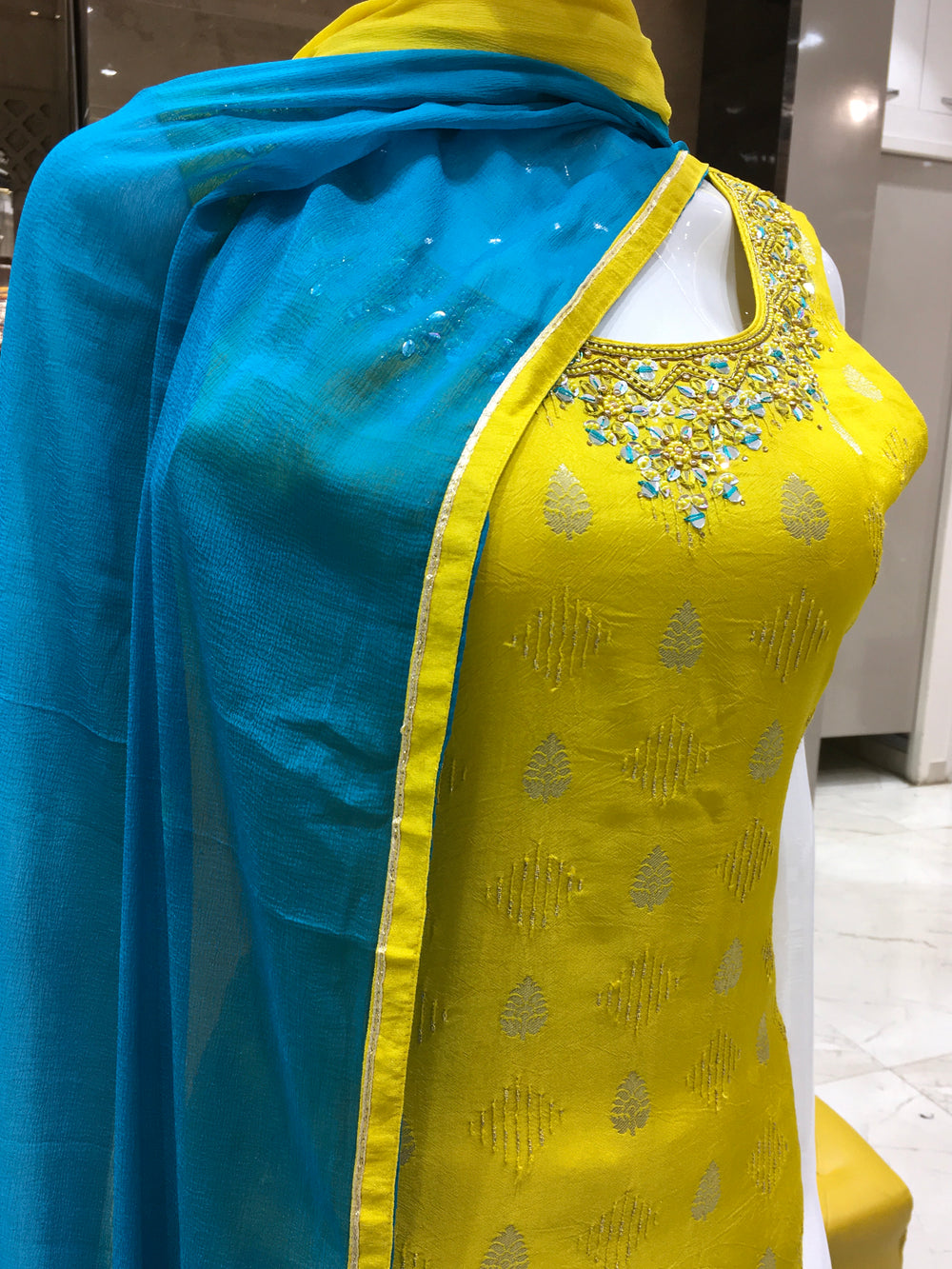 Chanderi Cotton Straight Cut Salwar Kameez in lemon green with embellished neckline, Banarasi motifs, and contrast blue shaded chiffon dupatta.