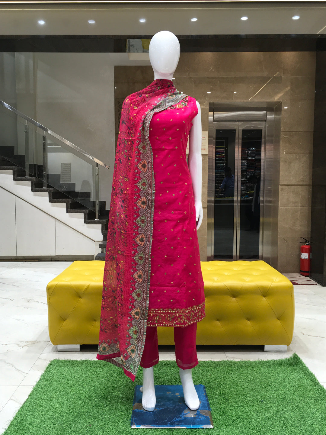 Chanderi Cotton Straight Cut Salwar Kameez with embroidered neckline, mirror detailing, pencil pant, and floral printed chiffon dupatta.
