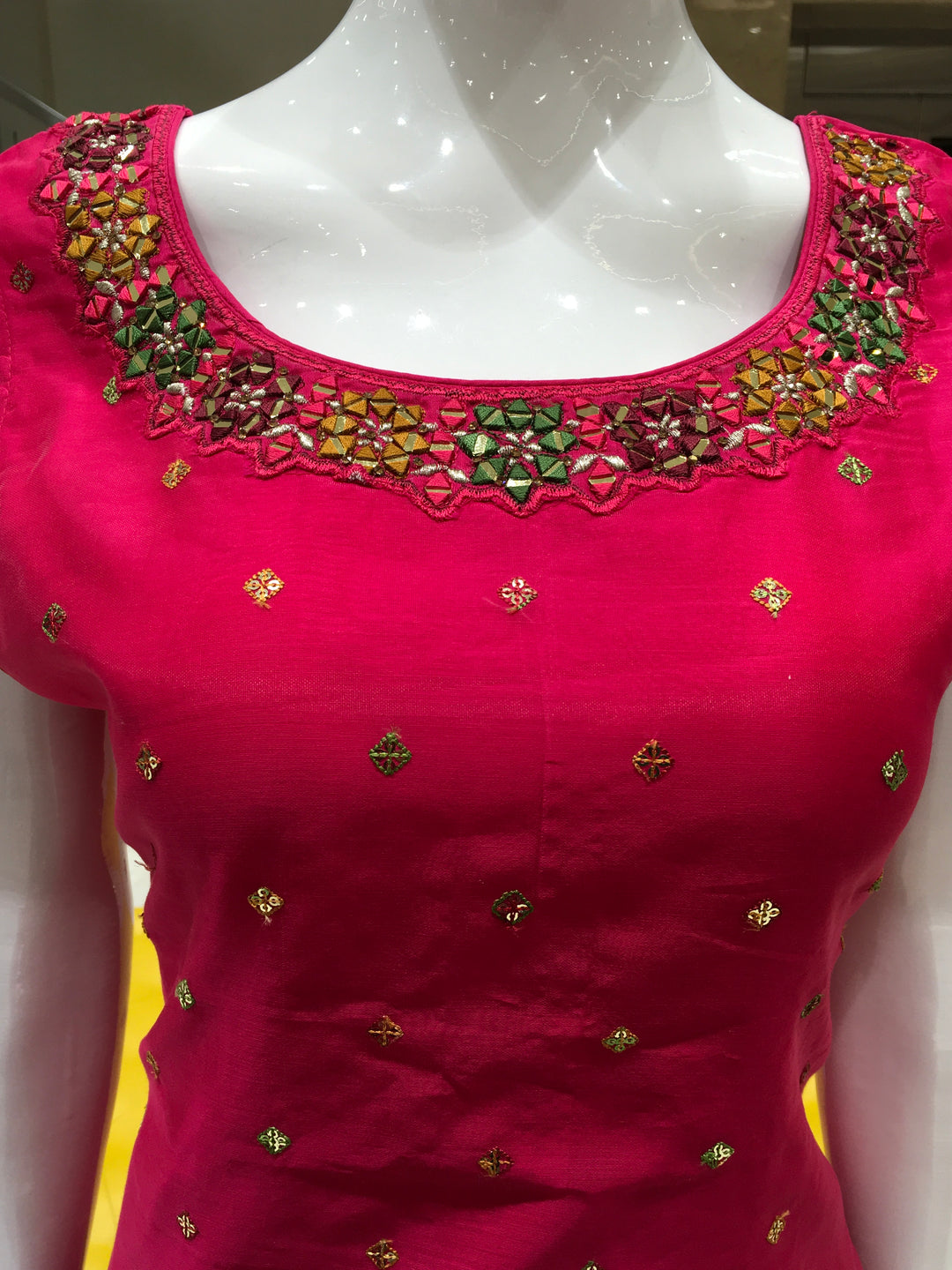 Chanderi Cotton Straight Cut Salwar Kameez with embroidered neckline, mirror detailing, pencil pant, and floral printed chiffon dupatta.