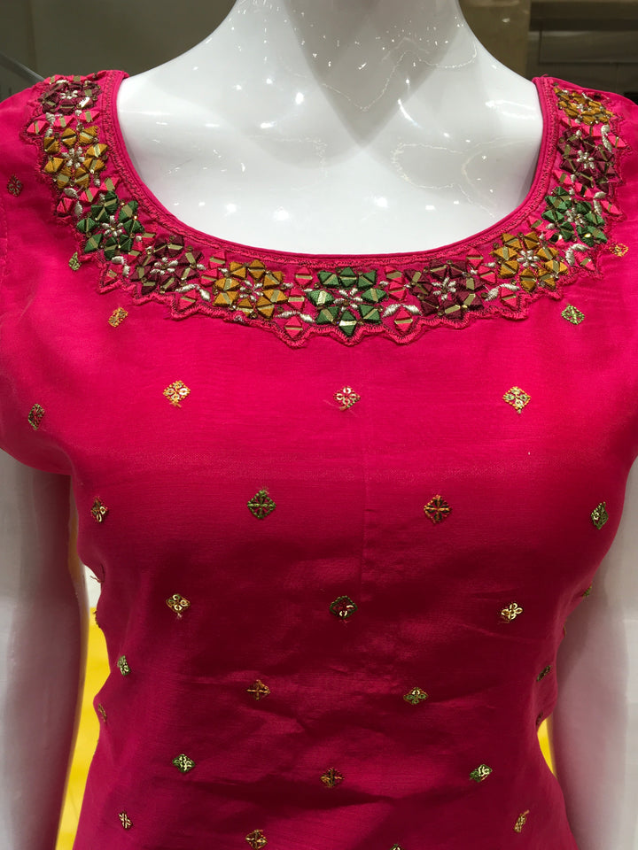 Chanderi Cotton Straight Cut Salwar Kameez with embroidered neckline, mirror detailing, pencil pant, and floral printed chiffon dupatta.