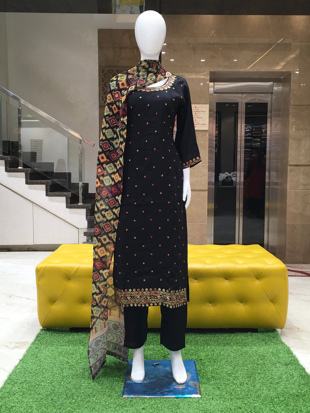 Black Chanderi Cotton Straight Cut Salwar Kameez with floral embroidery, sequins, and a multicolor printed dupatta displayed on a mannequin.