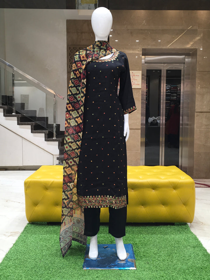 Black Chanderi Cotton Straight Cut Salwar Kameez with floral embroidery, sequins, and a multicolor printed dupatta displayed on a mannequin.