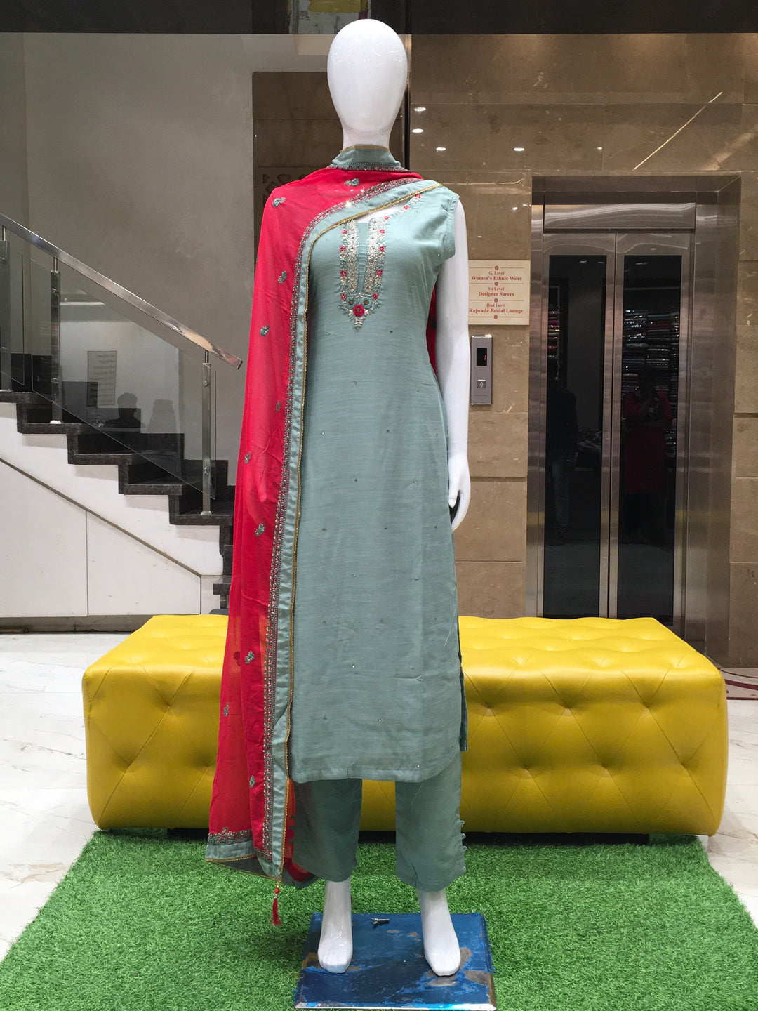 Sea Green Muslin Silk Straight Cut Salwar Kameez with embroidered neckline, sequins, and contrast dupatta displayed on mannequin.